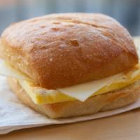 Egg And Cheese Breakfast Sandwich · Handcrafted egg patty, locally baked artisan ciabatta roll with Swiss