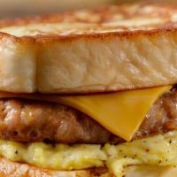 Ultimate Breakfast Sandwich · 2 pieces of French toast with your choice of meat, scrambled egg, and American cheese