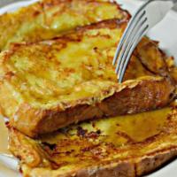 French Toasts · Two fluffy vanilla aromatic golden brown French toast