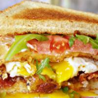L.T. With Fried Egg · Smoked apple wood bacon, fried egg, lettuce, tomato, mayo.