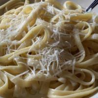 Fettuccine Alfredo · Fettuccine pasta with white alfredo sauce. served with salad and bread.