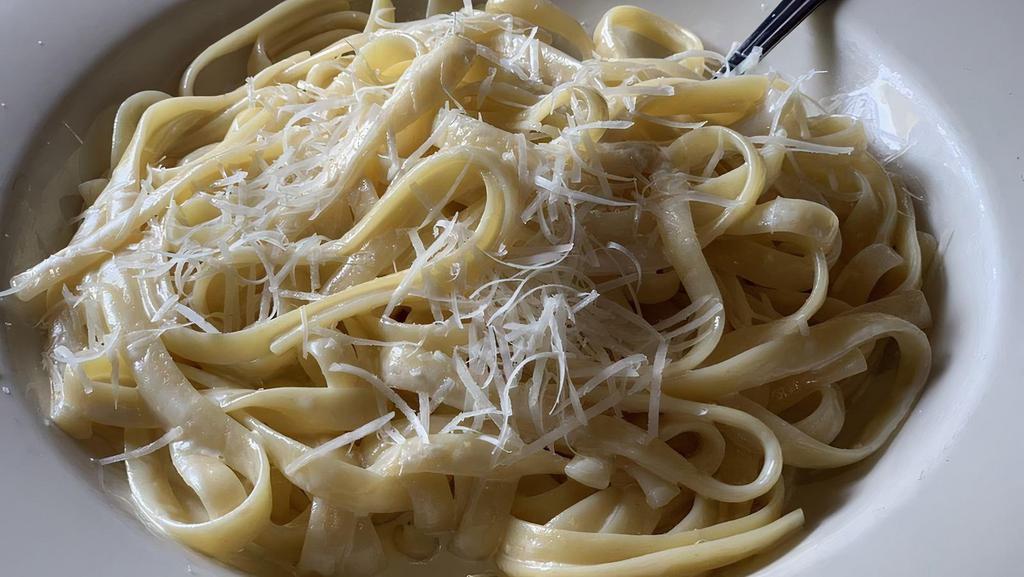 Fettuccine Alfredo · Fettuccine pasta with white alfredo sauce. served with salad and bread.