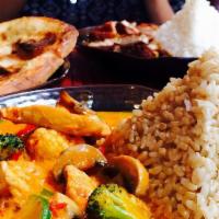 Panang  · A crowd favorite! Smooth red coconut curry, with a blended base of roasted bell peppers, mil...