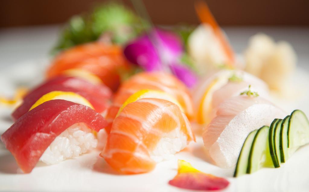 Sushi Sashimi Combo · Assorted of each. 4 pcs. sushi, 12 pcs. sashimi, 1 crunchy tuna.