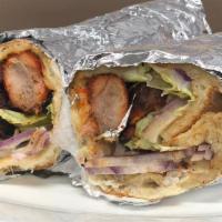 Chicken Tikka Wrap · Chicken Tikka wrapped in Naan Bread along with Mayo, lettuce, tomato and onions.