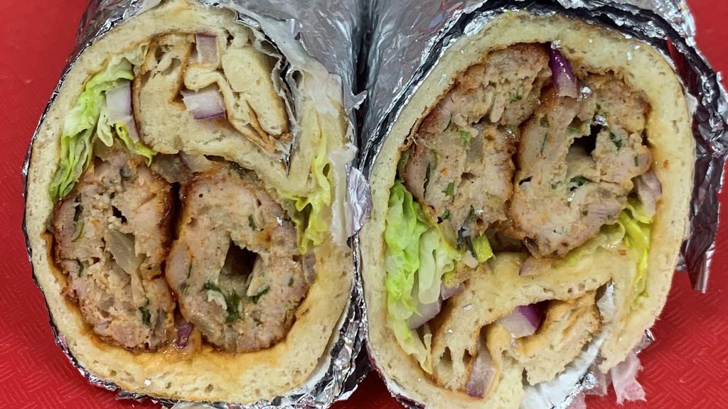 Beef Seekh Kabab Wrap · Beef Seekh Kabab wrapped in Naan Bread along with Mayo, lettuce, tomato and onions.