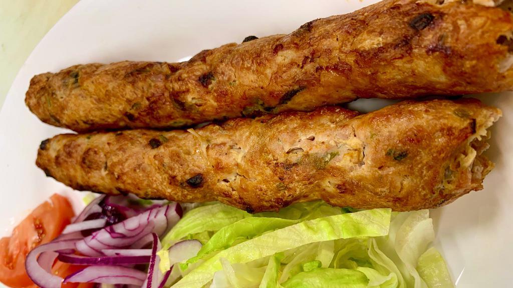 Chicken Seekh Kabab 2Pcs · Made with spiced minced chicken, formed into cylinders on skewers and baked in Tandoor oven. Served with Mint Sauce.