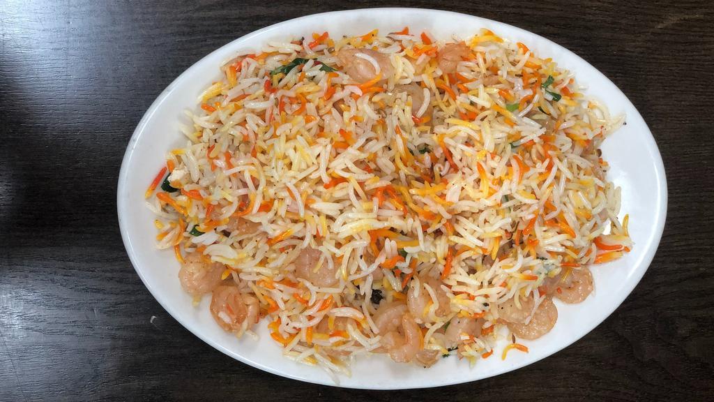 Shrimp Biryani · Biryani is one of the most amazing Royal Delicacies, Made by Layering g marinated grilled shrimps, parboiled Pakistani basmati rice and spices.