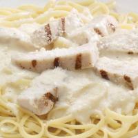 Chicken Alfredo Pasta · A bed of pasta and grilled chicken strips in alfredo sauce and finished with Pecorino Romano...