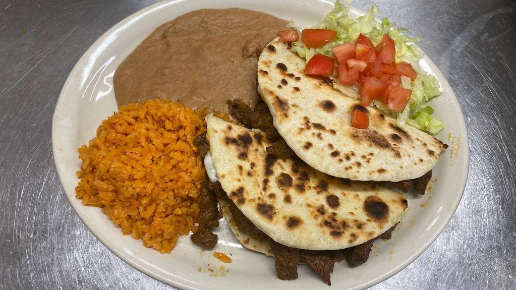 Quesadilla Plate · 2 flour/corn tortillas filled with melted white cheese and your choice of meat. served with sliced avocado re-fried beans and rice.