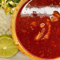 Menudo · 32 ounce cup filled with carne and hominey served with diced onions, diced chile, and 2 flou...