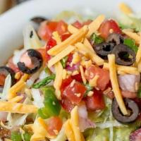 Lost Dog Dip · 7-layers starting with our homemade chili, cheddar cheese, guacamole, shredded lettuce, pico...