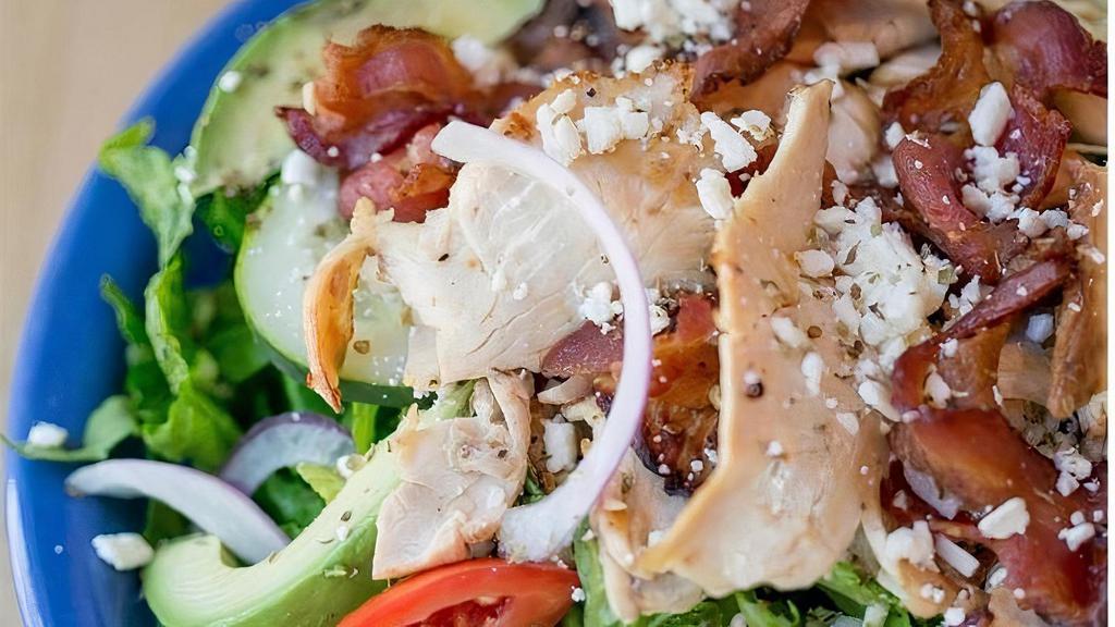 Fat Willis · Sliced chicken breast, crispy bacon, fresh avocado, crumbled feta cheese, tomatoes, cucumbers, and red onions on top of mixed greens. Served with peppery parmesan dressing on the side.