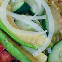 #43 Healthy Dog · Hummus, cucumber, tomato, onion, avocado, fresh spinach, and lettuce served cold on a warm p...