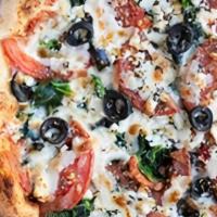 Ind Greek Pie · Homemade pizza sauce, spinach, onions, tomatoes, black olives, topped with feta and mozzarel...
