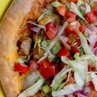 Ind Taco · Homemade crust, zesty sauce, cheddar cheese, shredded lettuce, and pico de gallo. Choose fro...