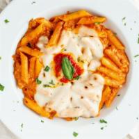 Pasta Al Forno · Penne pasta, sautéed with Squisito®   tomato sauce, ground beef, ricotta, and mozzarella, th...
