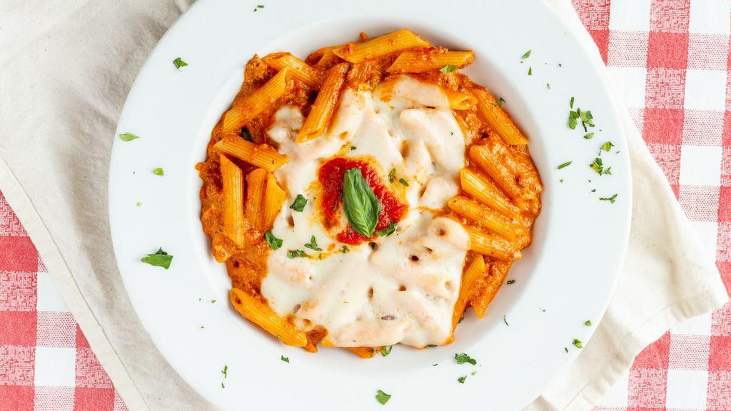 Pasta Al Forno · Penne pasta, sautéed with Squisito®   tomato sauce, ground beef, ricotta, and mozzarella, then baked to perfection.