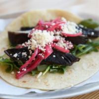 Ma-La Bello · Sichuan blistered portobello mushrooms with baby arugula, sweet pickled red onions, kale pes...