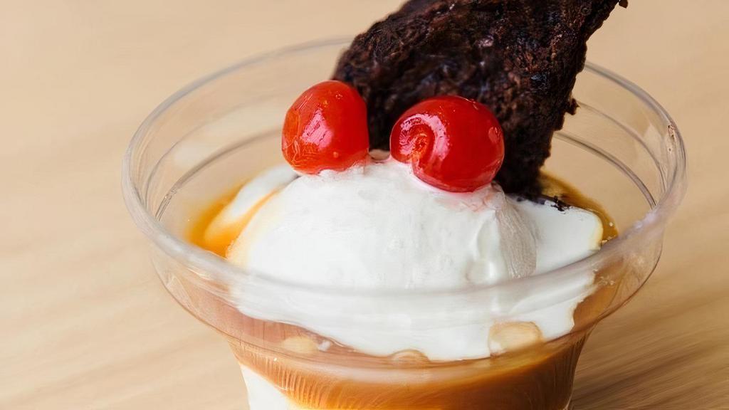 Salted Caramel Brownie Sundae · A warm chocolate brownie topped with fresh vanilla frozen custard, drenched in rich caramel, and topped with Fleur De Sel gourmet sea salt.