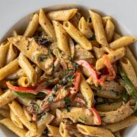 Pasta Penne · grilled chicken, sauteed red bell peppers, cilantro, green bell peppers and onions in a spic...