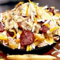 Loaded Smoked Sausage · Sliced grilled smoked sausage topped with pico de gallo, cheddar cheese, monterey cheese, so...