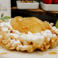 Apple Funnel Cake · Freshly prepared funnel cake, sprinkled with powdered sugar, topped with warm apple topping.