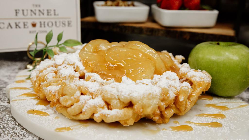 Apple Funnel Cake · Freshly prepared funnel cake, sprinkled with powdered sugar, topped with warm apple topping.