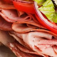 Italian Sub · Double sliced ham, pepperoni, genoa salami, and capicola ham with our Italian sub sauce and ...