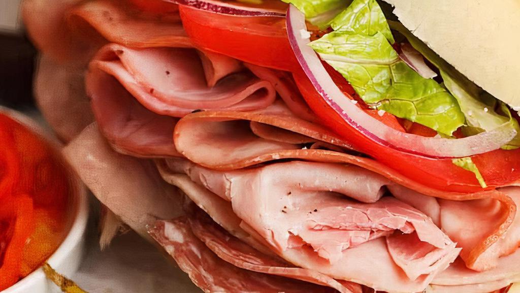 Italian Sub · Double sliced ham, pepperoni, genoa salami, and capicola ham with our Italian sub sauce and your choice of cheese.