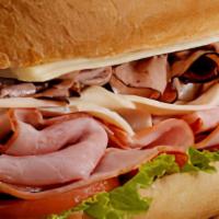 The Manhattan Sub · Sliced turkey, ham, bacon, with your choice of cheese.