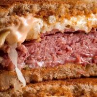 The Ultimate Reuben · Double sliced corn beef,  thousand island dressing and sauerkraut on Rye bread with Swiss ch...