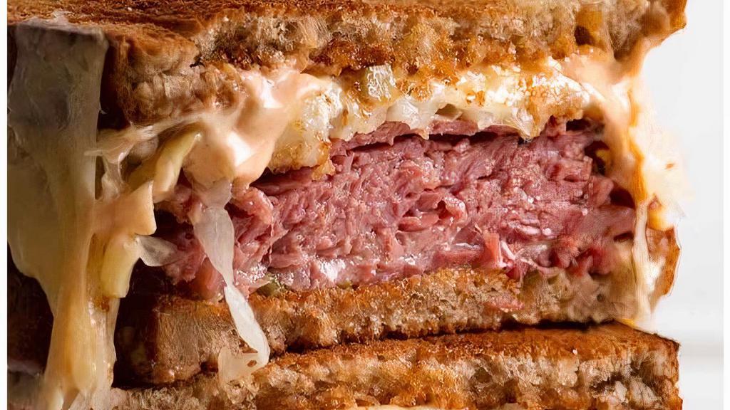 The Ultimate Reuben · Double sliced corn beef,  thousand island dressing and sauerkraut on Rye bread with Swiss cheese