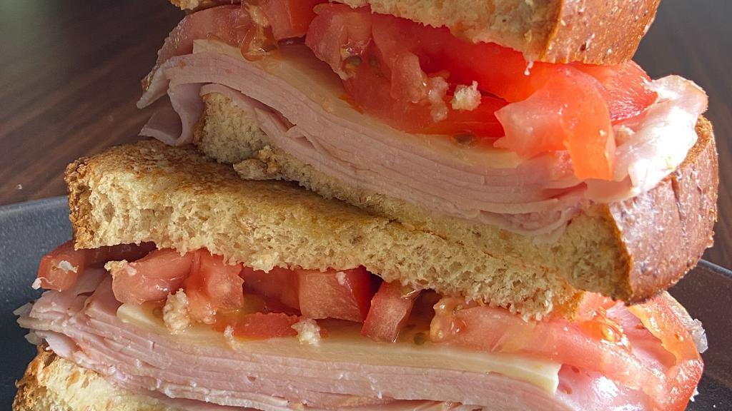 Ham & Cheese Melt · Ham, gruyere cheese sliced tomato
Honey wheat or white bread. Come with Chips and a Pickle