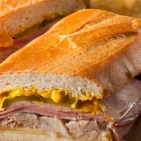 Cuban Sandwich · Pulled pork, honey ham, mustard and pickle with your choice of cheese on white bread. Comes ...