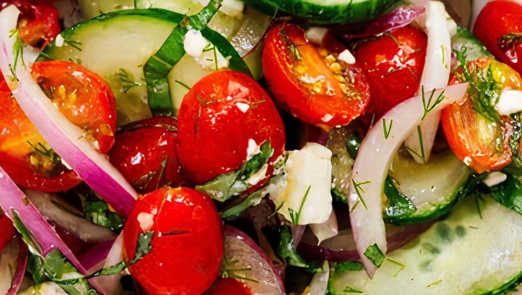 Cucumber Tomato Salad · Cucumbers, red onions, tomatoes, mozzarella balls and balsamic vinaigrette