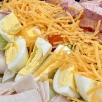 Chef Salad · Iceberg lettuce, tomato, onion, cucumber, ham, turkey, bacon, hard-boiled egg and cheddar ch...