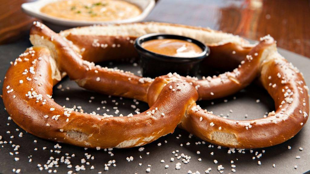 Giant Soft Authentic Bavarian Pretzel · Served with Spicy, sweet mustard.