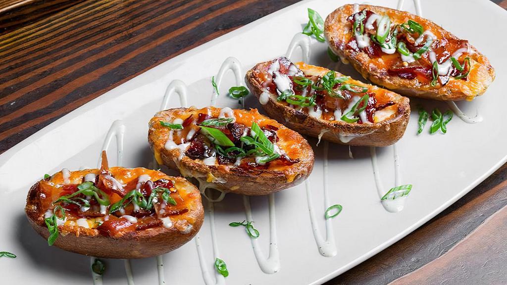 Loaded Potato Skins · 4 Half Potato Skins – Cheddar & Pepper Jack 
Cheese Mix – Candied Bacon – Green Onions & 
Ranch