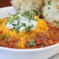 Red Hot Chili - Bowl · Simmered Chipotle Ground Beef & Pork, Beans, Onions, Peppers, Tomatoes, Corn, Garnished with...
