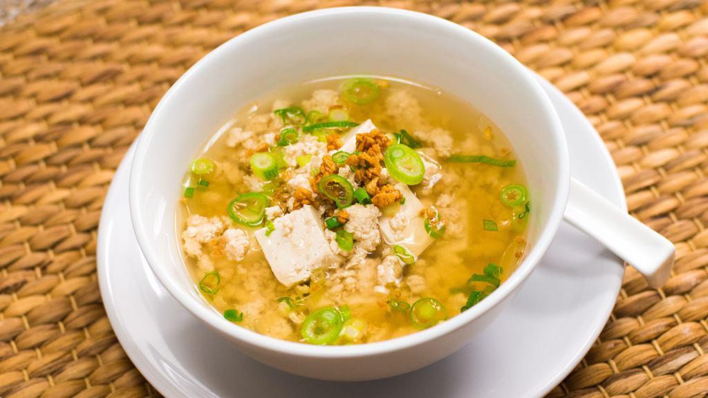 Tofu Soup · Cubed soft tofu, ground chicken, scallions in a light clear broth with fragrant from fried garlic oil.
