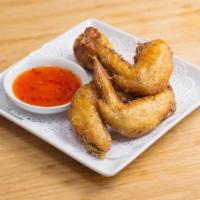 Wings Todd (6) · Thai style marinated deep-fried chicken wings served with Thai sweet chili sauce.