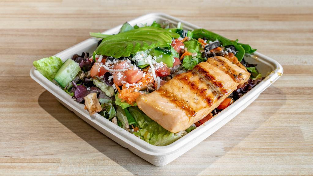 Salmon And Avocado Salad · Grilled honey lime salmon, sliced avocado, mixed baby greens,. mushrooms, black olives, carrots, roasted red peppers,. cucumbers, tomatoes, and queso fresco served with lime-cilantro. dressing