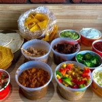 Family Taco Dinner · pulled chicken, taco beef, brisket or mixed veggies. served with refried beans, mexican rice...