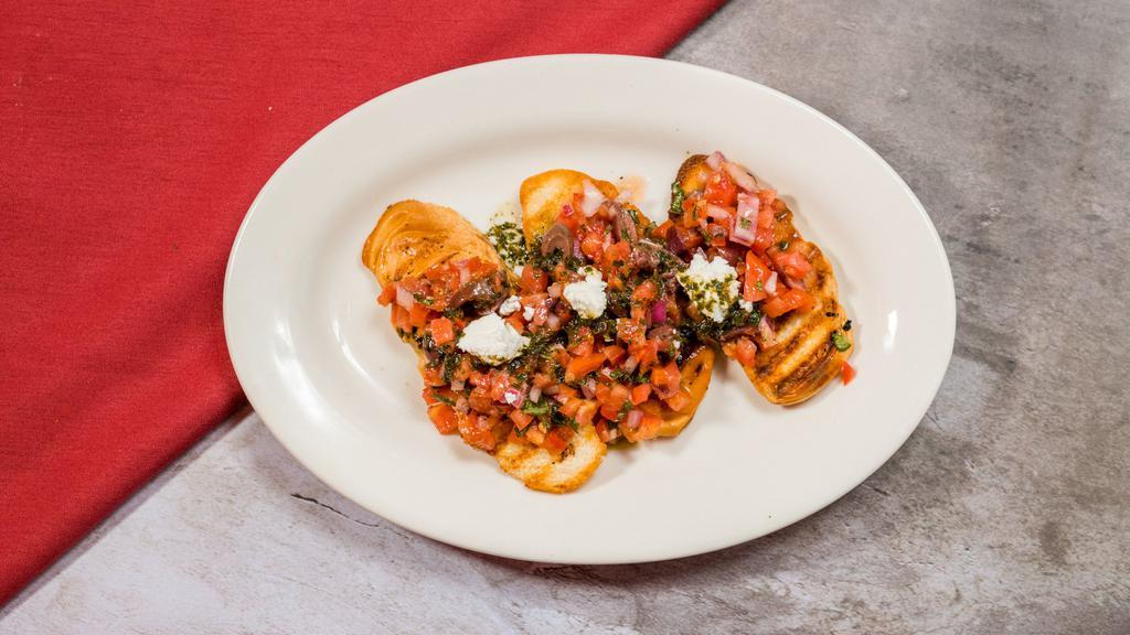 Bruschetta · Toasted bread topped with tomatoes, olives, onions olive oil, goat cheese.
