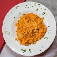 Fettuccine Bolognese · Ground veal simmered in a tomato cream sauce with fettuccine. Served with a cup of minestron...