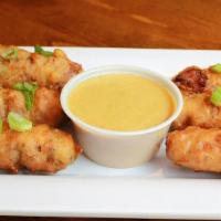 Bacon Wrapped Jalapeno Poppers (D) · Stuffed with house made artichoke dip, cheddar cheese & wrapped in thick cut peppered bacon,...