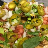 Nachos · Beef, chicken, , or chili pilled high!
Topped with lettuce, onion, tomato, jalapenos, and a ...