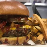 Billy Goat Burger · Topped with bacon, house made orings, BBQ sauce, and Cheddar cheese.