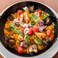 Paella · saffron rice, swordfish, chorizo, PEI mussels, point judith squid, shrimp, sweet peas, roast...